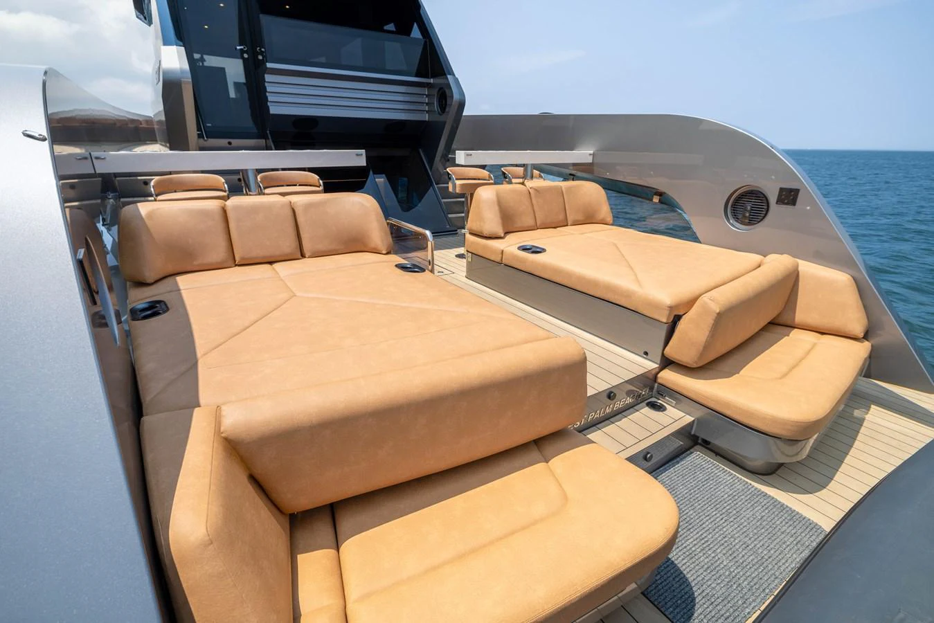 The yacht features a luxurious sundeck with comfortable tan loungers overlooking the sea. aboard GRIT Yacht for Sale