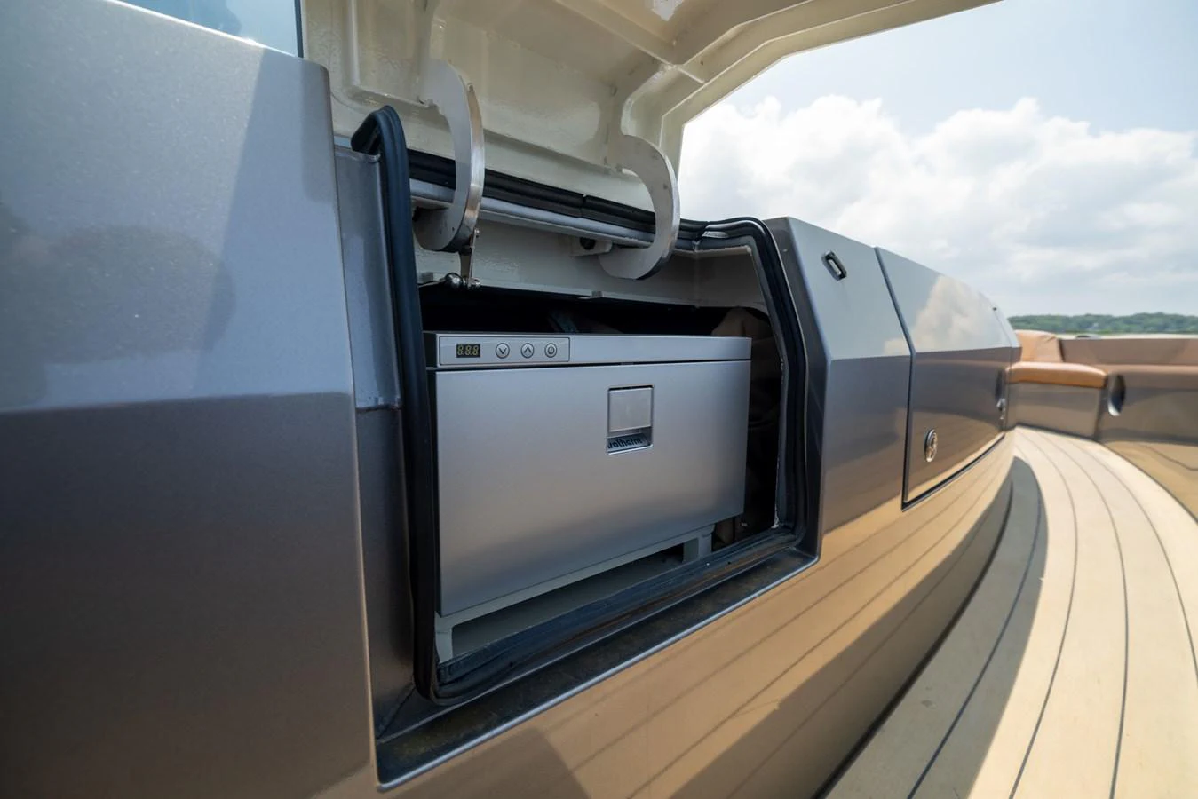 A sleek, built-in outdoor refrigerator is revealed on the yacht's deck. aboard GRIT Yacht for Sale