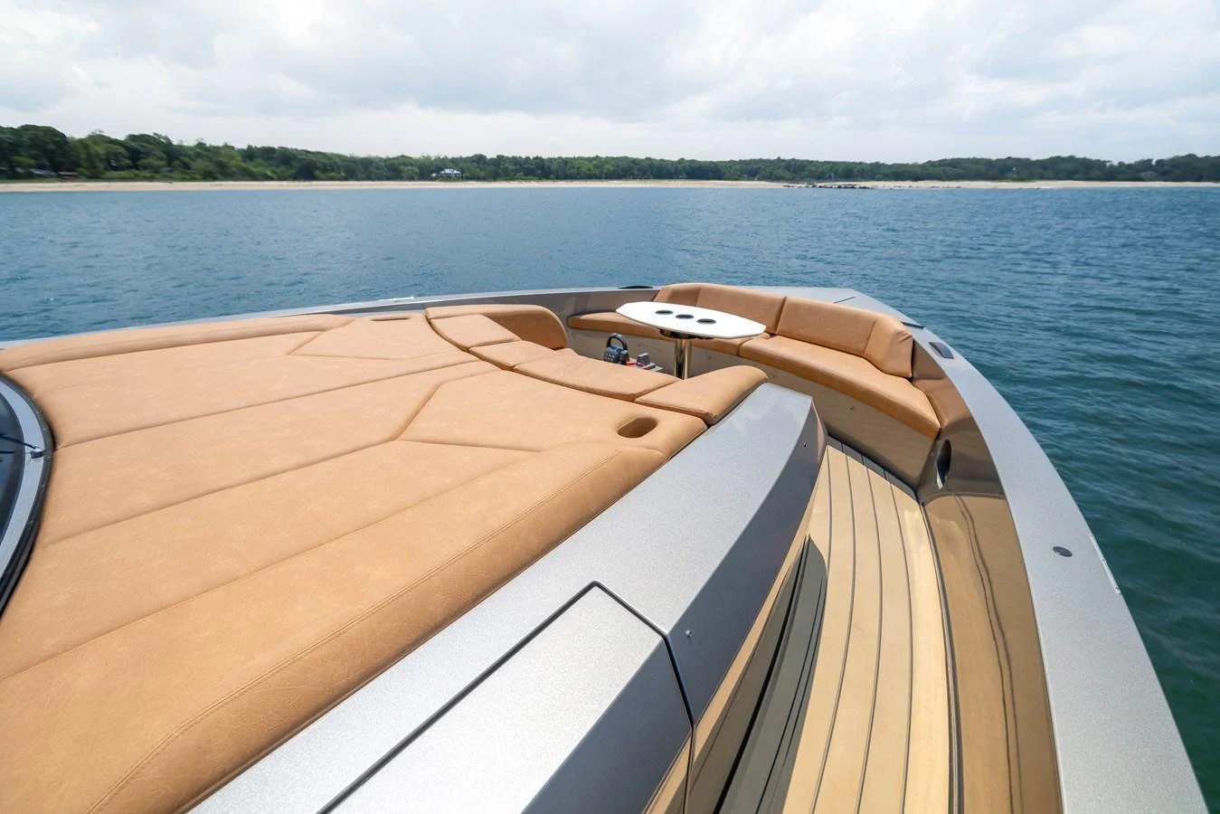The yacht's foredeck features luxurious sun pads and a seating area, perfect for relaxation. aboard GRIT Yacht for Sale