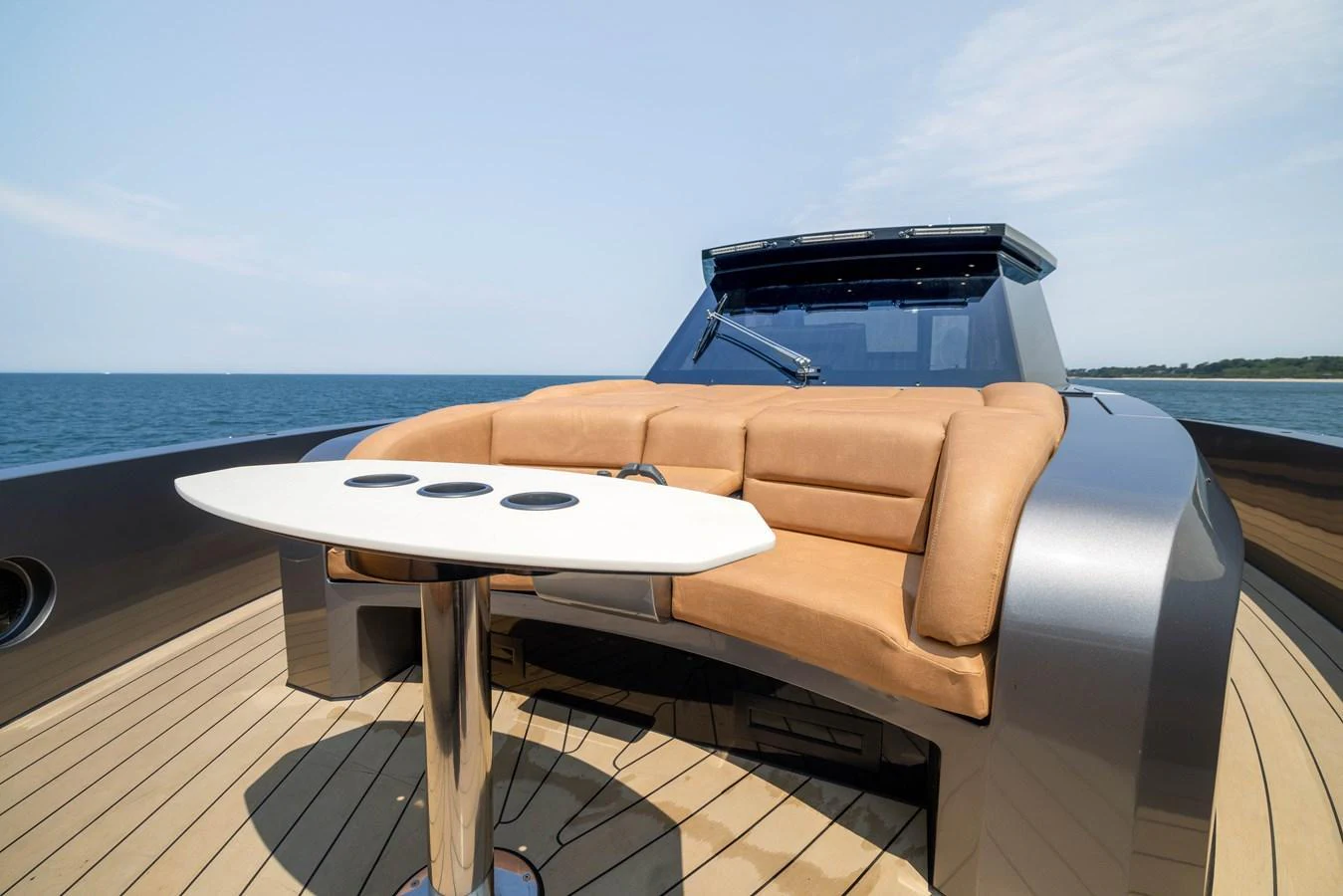 The foredeck features a sleek seating area with a modern table, offering a perfect spot to enjoy the ocean views. aboard GRIT Yacht for Sale