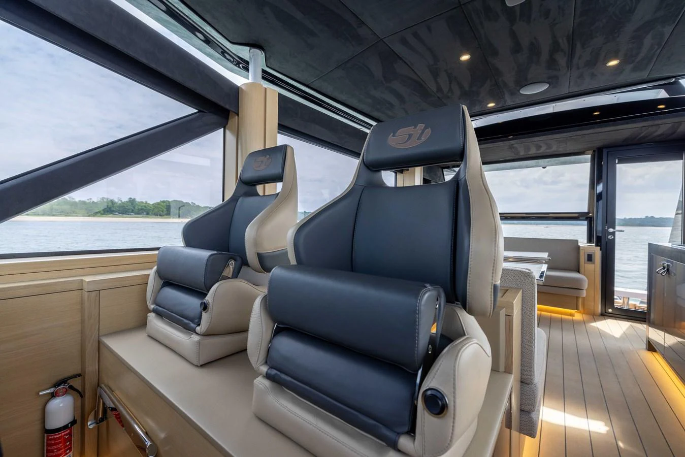 The helm area features luxurious seating with a panoramic view of the surrounding waters. aboard GRIT Yacht for Sale
