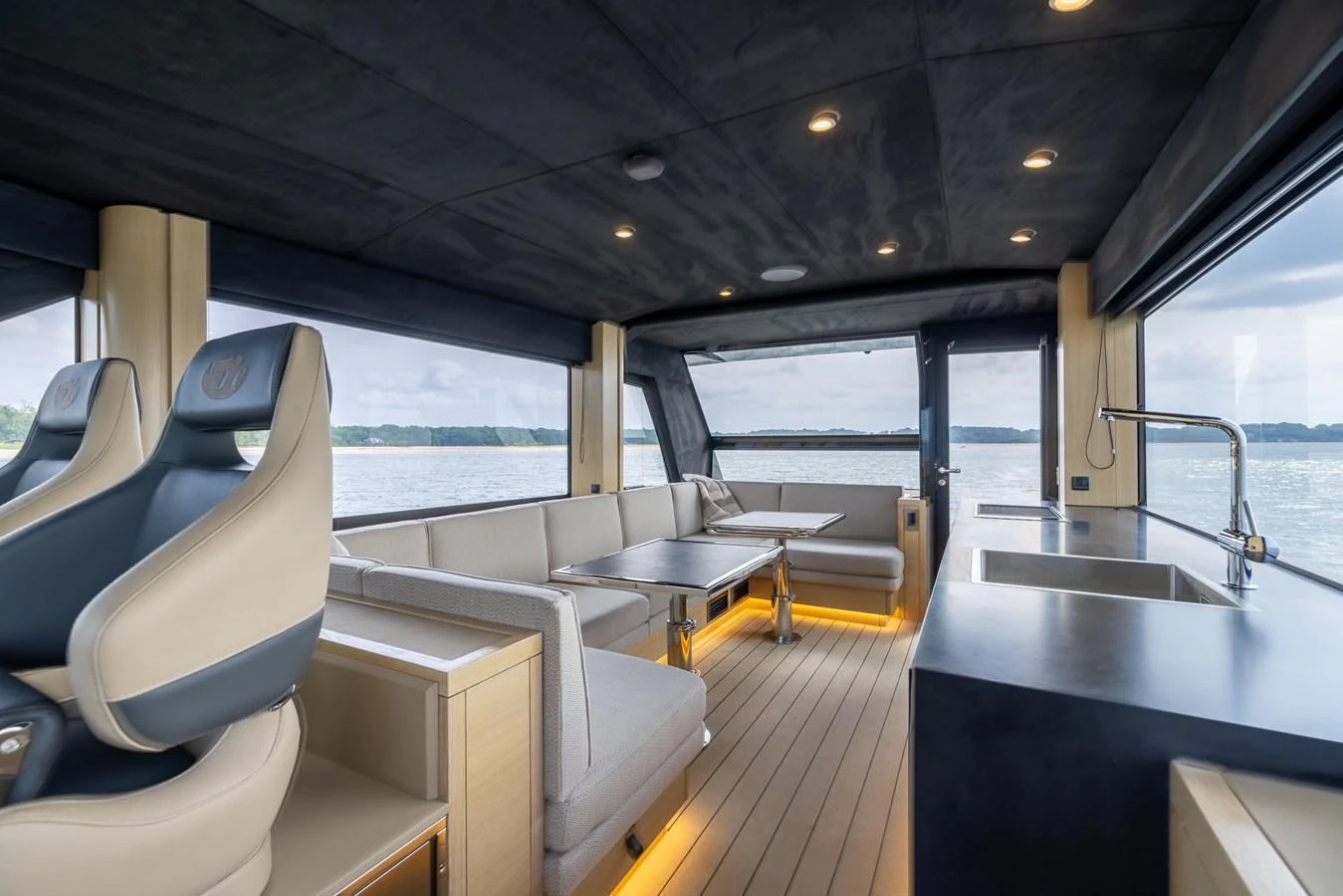 The salon offers a spacious and modern seating area with panoramic views and luxurious finishes. aboard GRIT Yacht for Sale