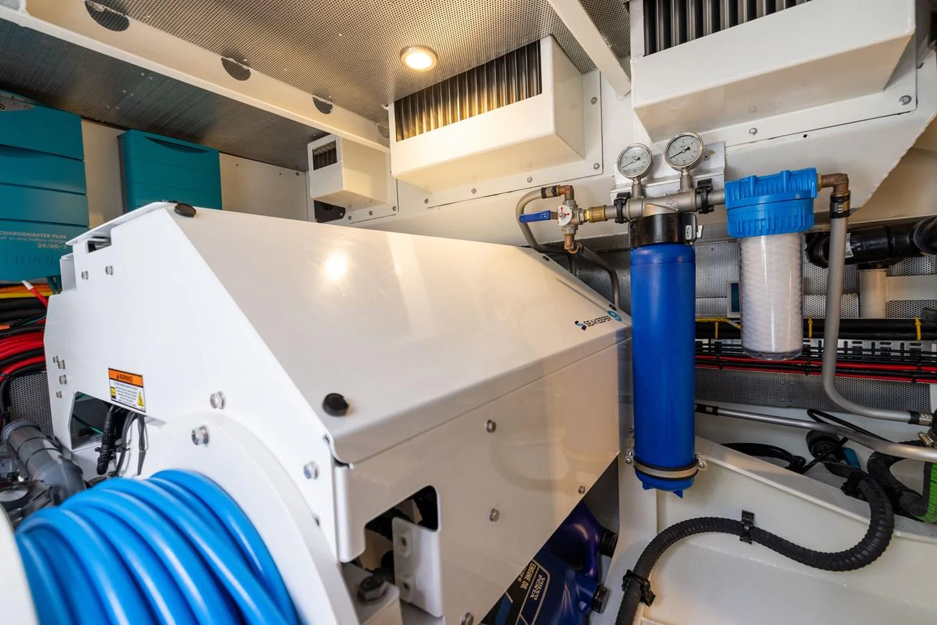 The image showcases the yacht's well-maintained engine room with various technical components. aboard GRIT Yacht for Sale