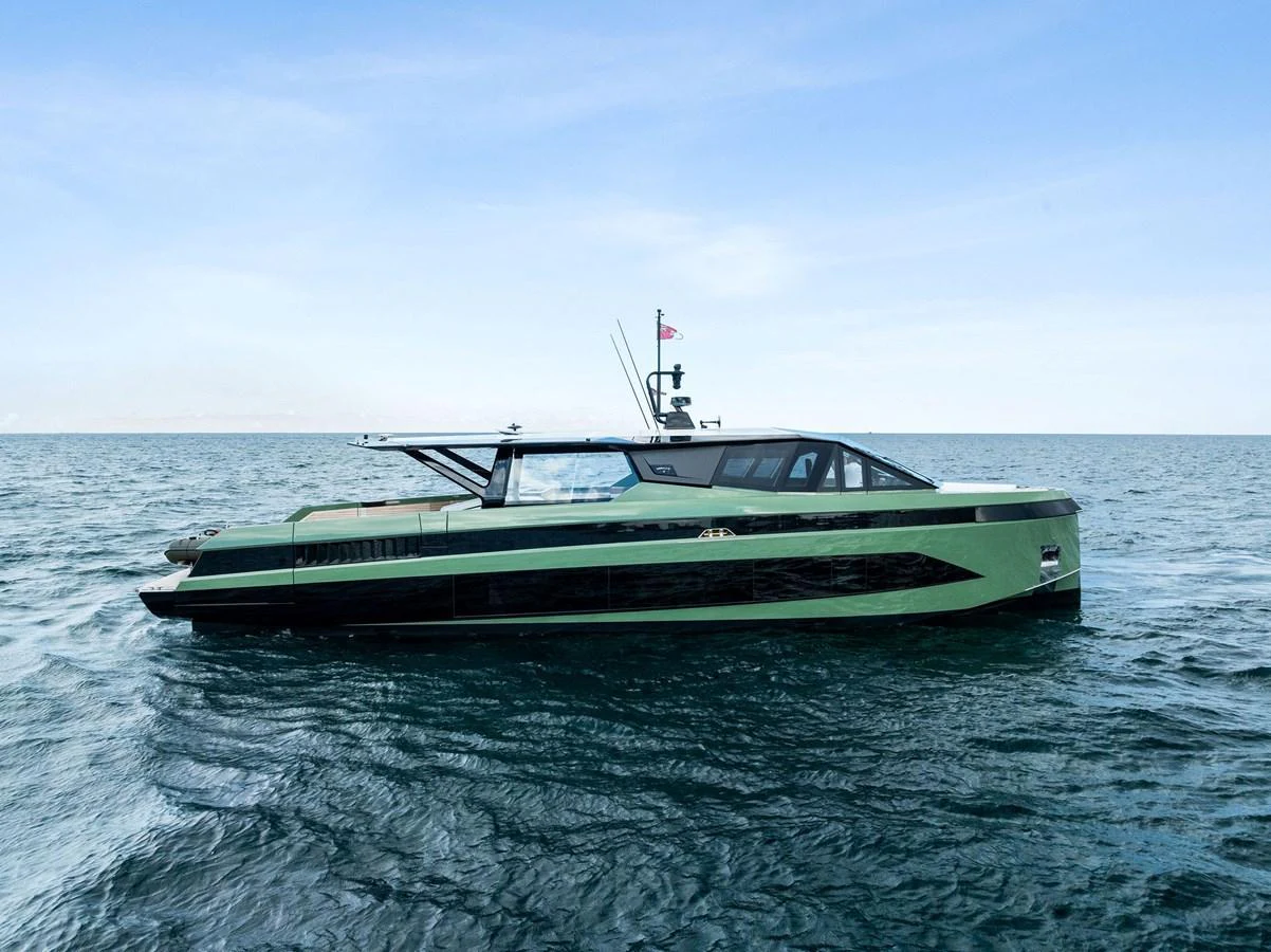 A sleek, modern yacht glides effortlessly on calm waters under a clear blue sky. aboard ANOTHER WORLD Yacht for Sale