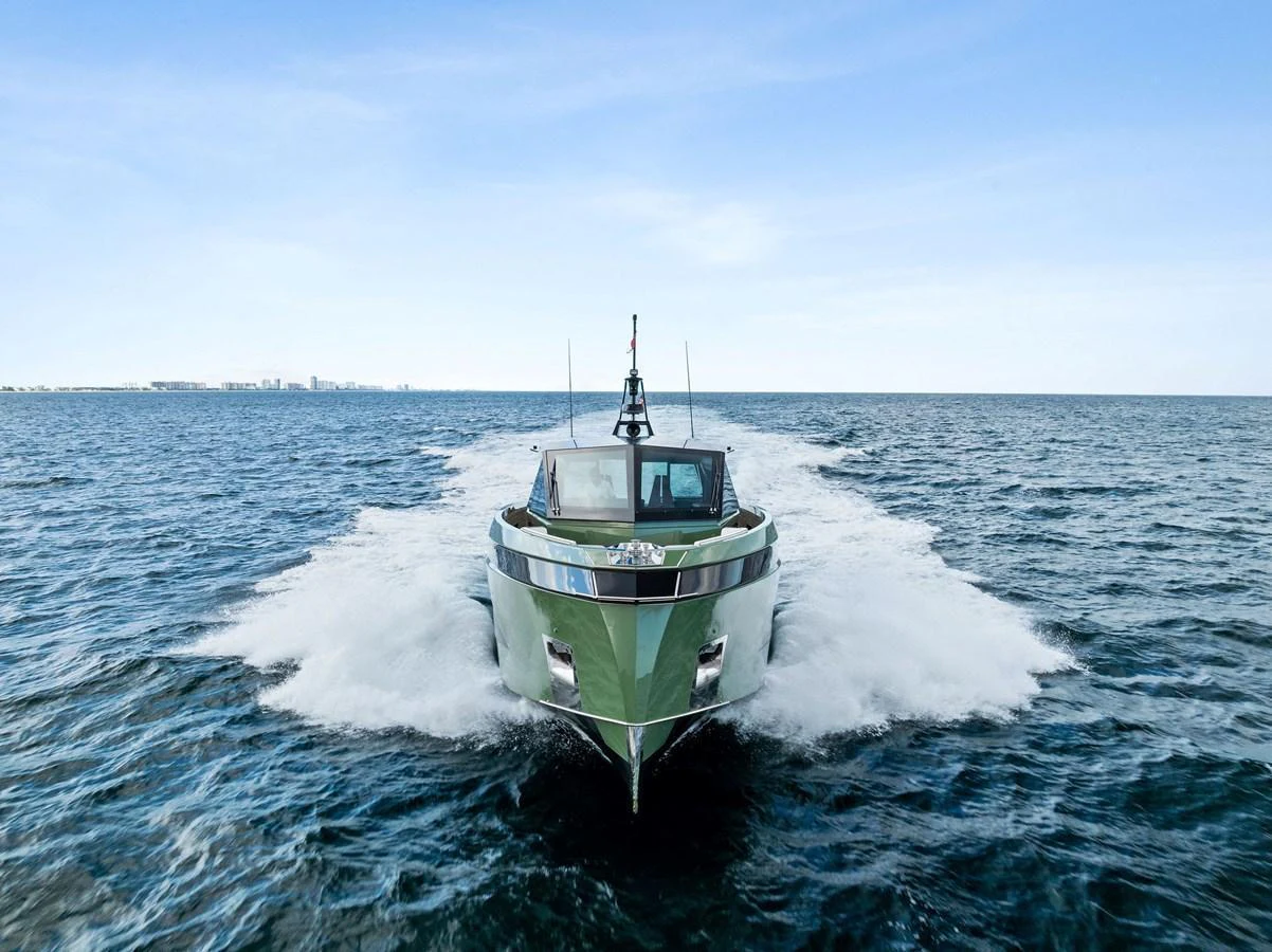 A sleek yacht cuts through the water, showcasing its modern design and powerful performance. aboard ANOTHER WORLD Yacht for Sale
