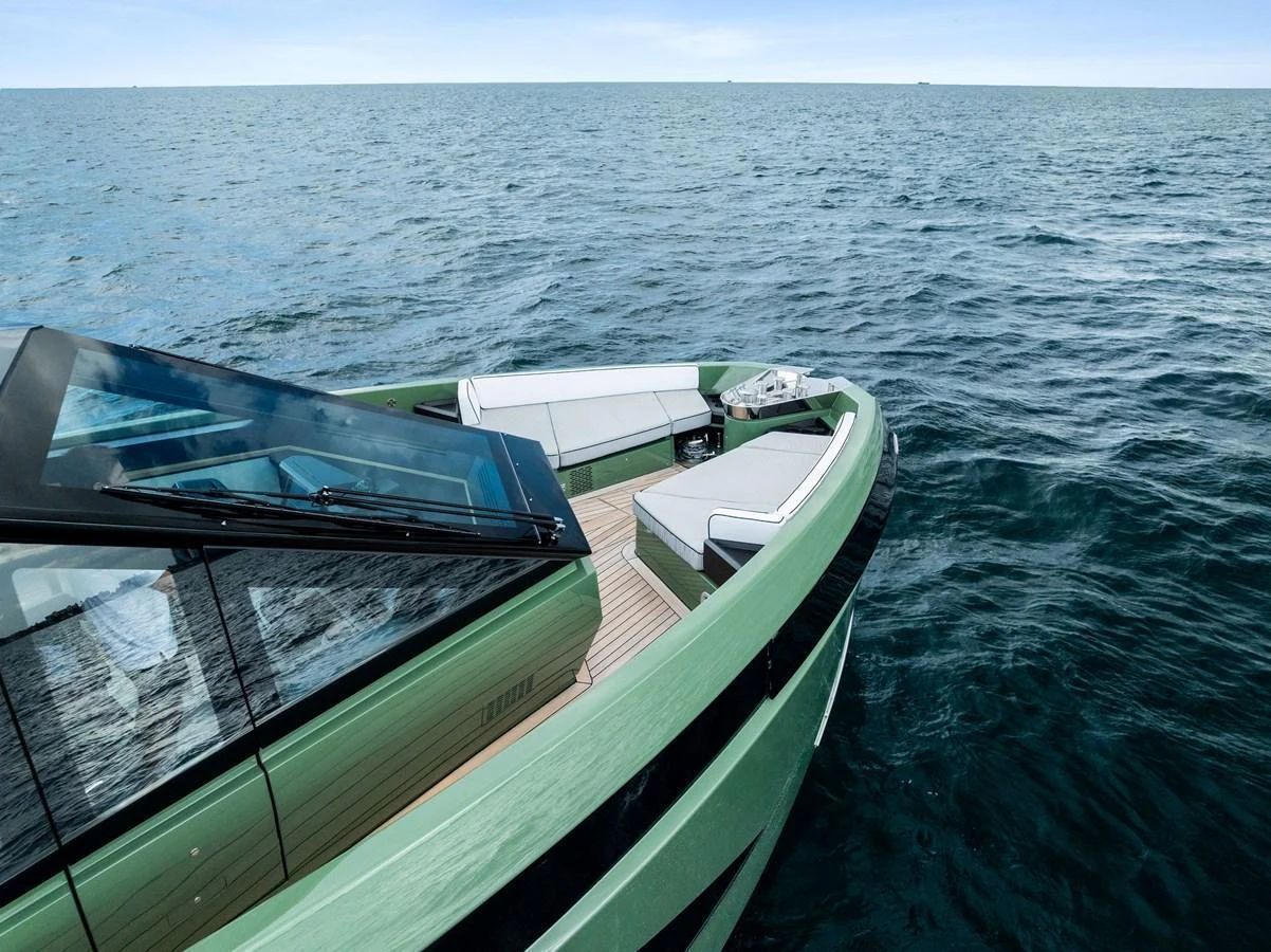 The sleek bow of the yacht features modern design elements and comfortable seating areas, perfect for relaxation. aboard ANOTHER WORLD Yacht for Sale