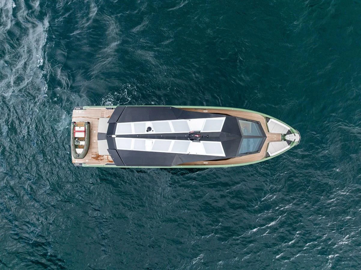 A sleek, modern yacht is captured from an aerial view, showcasing its streamlined design and expansive deck space. aboard ANOTHER WORLD Yacht for Sale