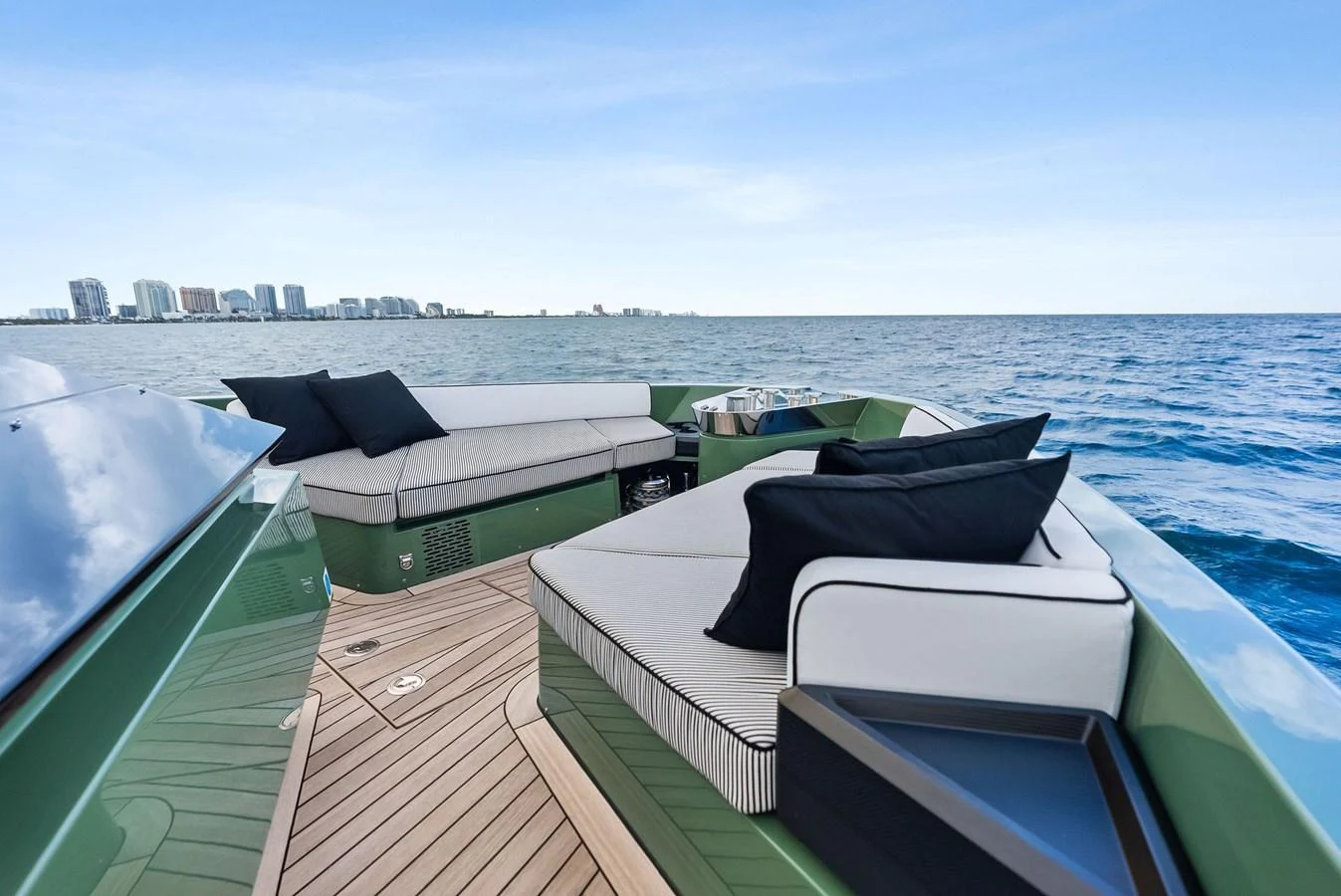 The yacht's aft deck features luxurious seating with a stunning ocean backdrop. aboard ANOTHER WORLD Yacht for Sale