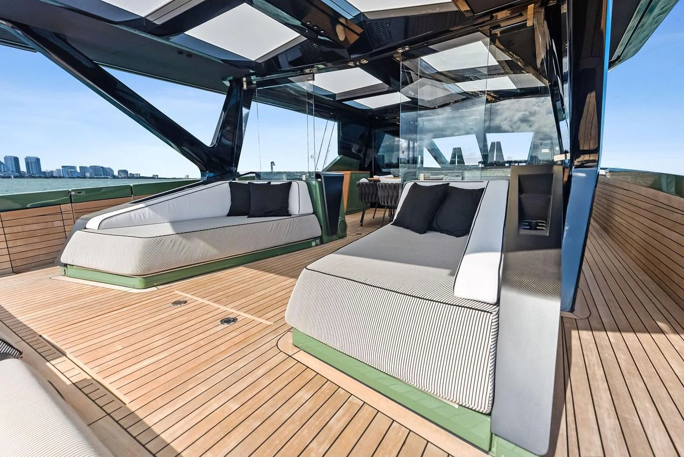 The sundeck offers luxurious lounging areas with modern design and panoramic views. aboard ANOTHER WORLD Yacht for Sale