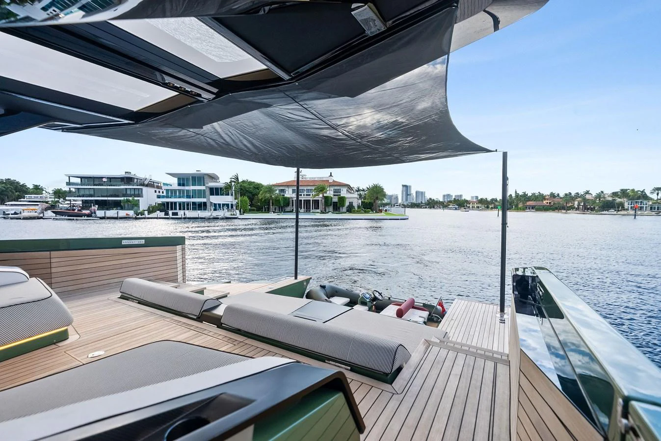 The aft deck offers a spacious and stylish area for relaxation with a scenic view of the waterfront. aboard ANOTHER WORLD Yacht for Sale