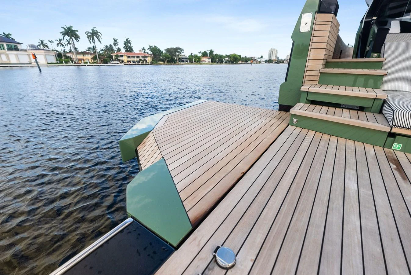The yacht features a spacious swim platform with elegant wooden decking, perfect for easy water access. aboard ANOTHER WORLD Yacht for Sale