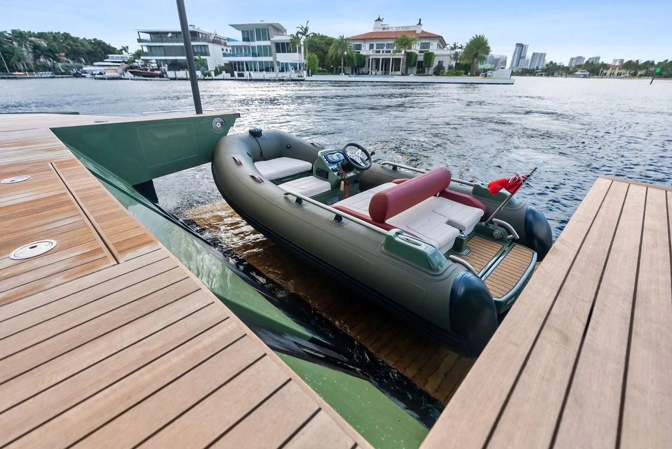 A sleek tender is positioned on the yacht's platform, ready for launch into the water. aboard ANOTHER WORLD Yacht for Sale