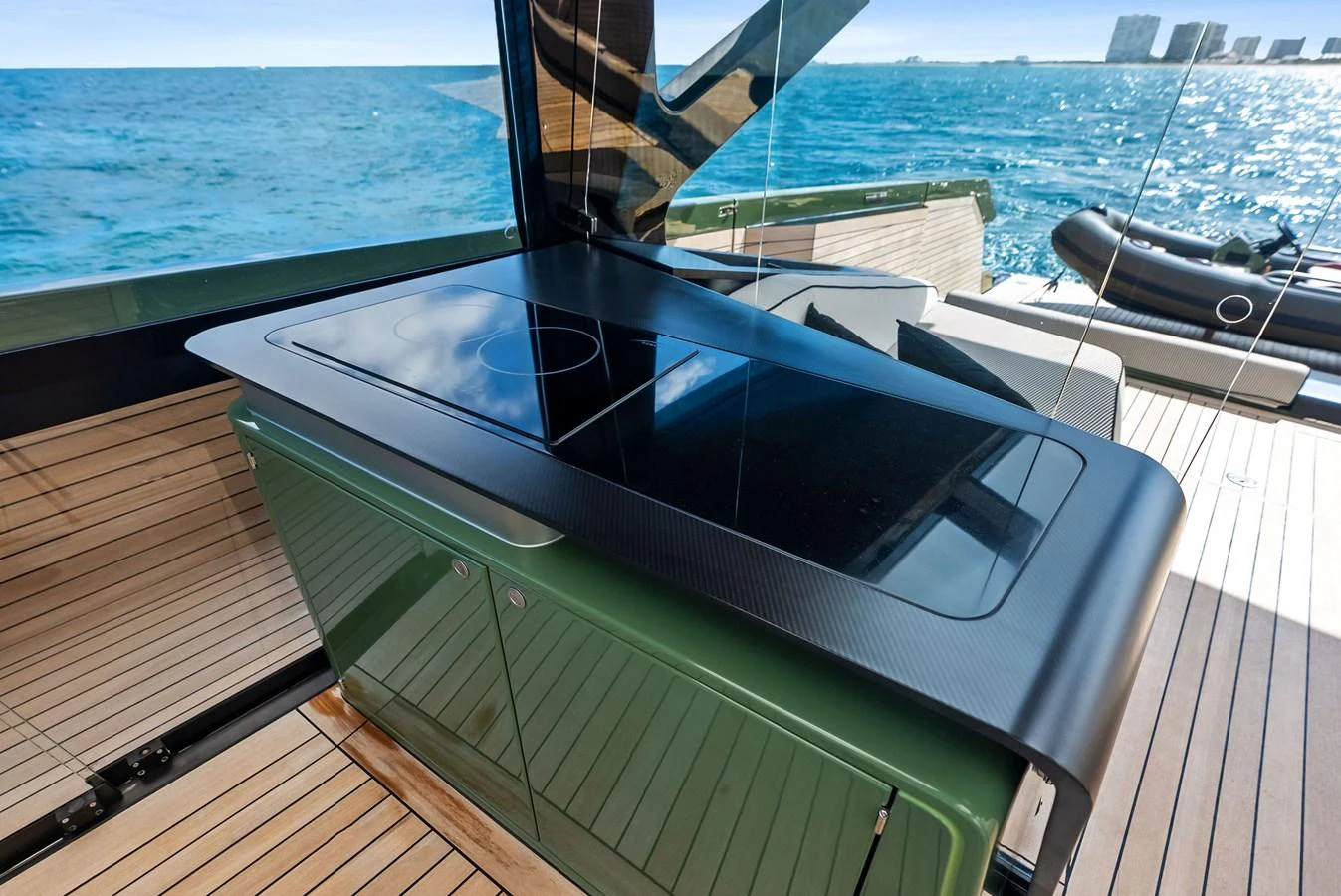 A sleek outdoor kitchen area on the yacht, featuring a modern stovetop and elegant design. aboard ANOTHER WORLD Yacht for Sale