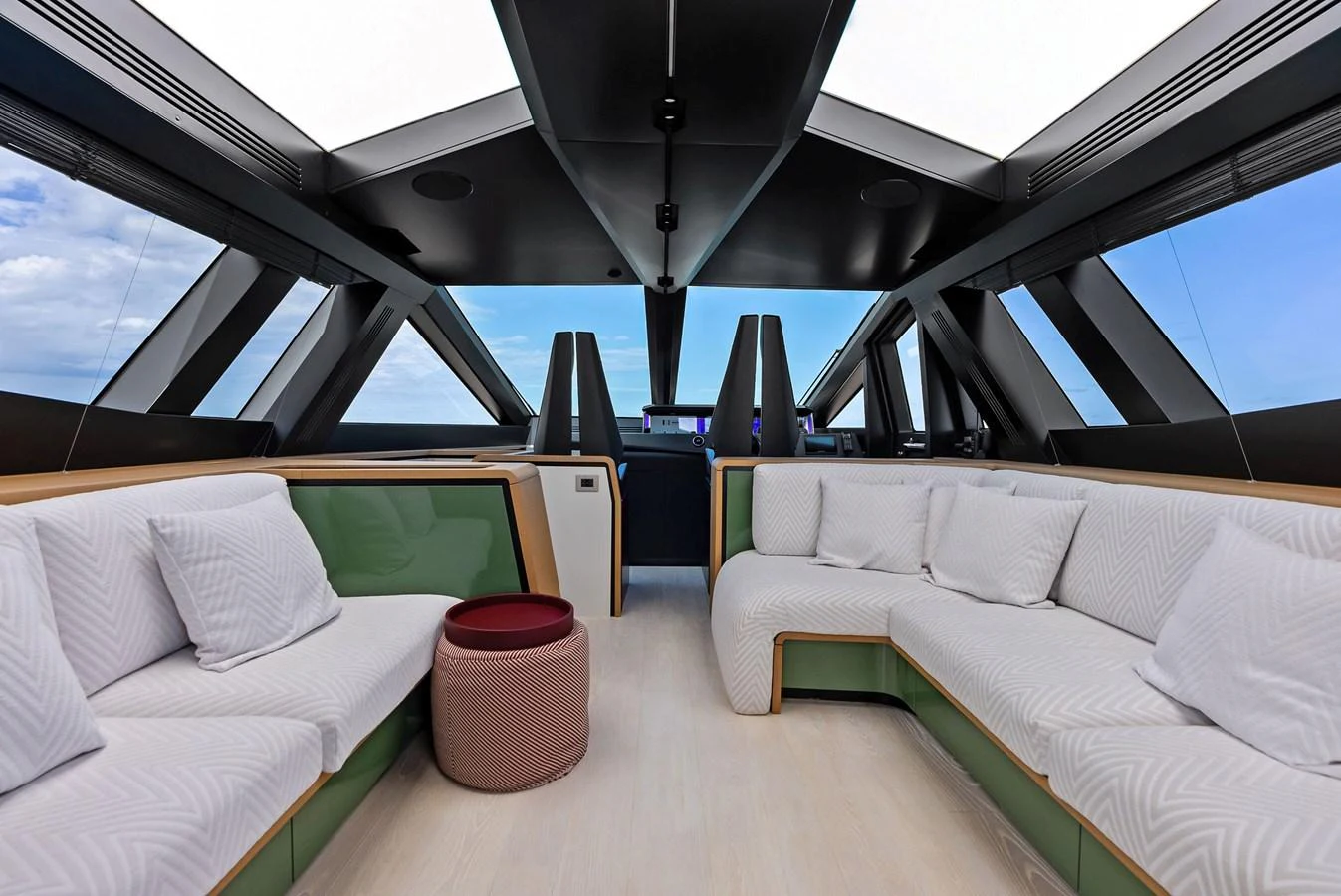 The yacht's salon features modern seating with panoramic windows and a sleek design. aboard ANOTHER WORLD Yacht for Sale