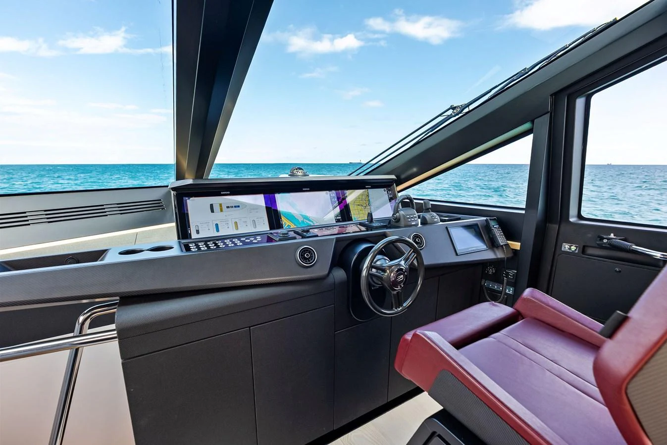 The helm station offers a sleek and modern design with advanced navigation equipment and panoramic sea views. aboard ANOTHER WORLD Yacht for Sale