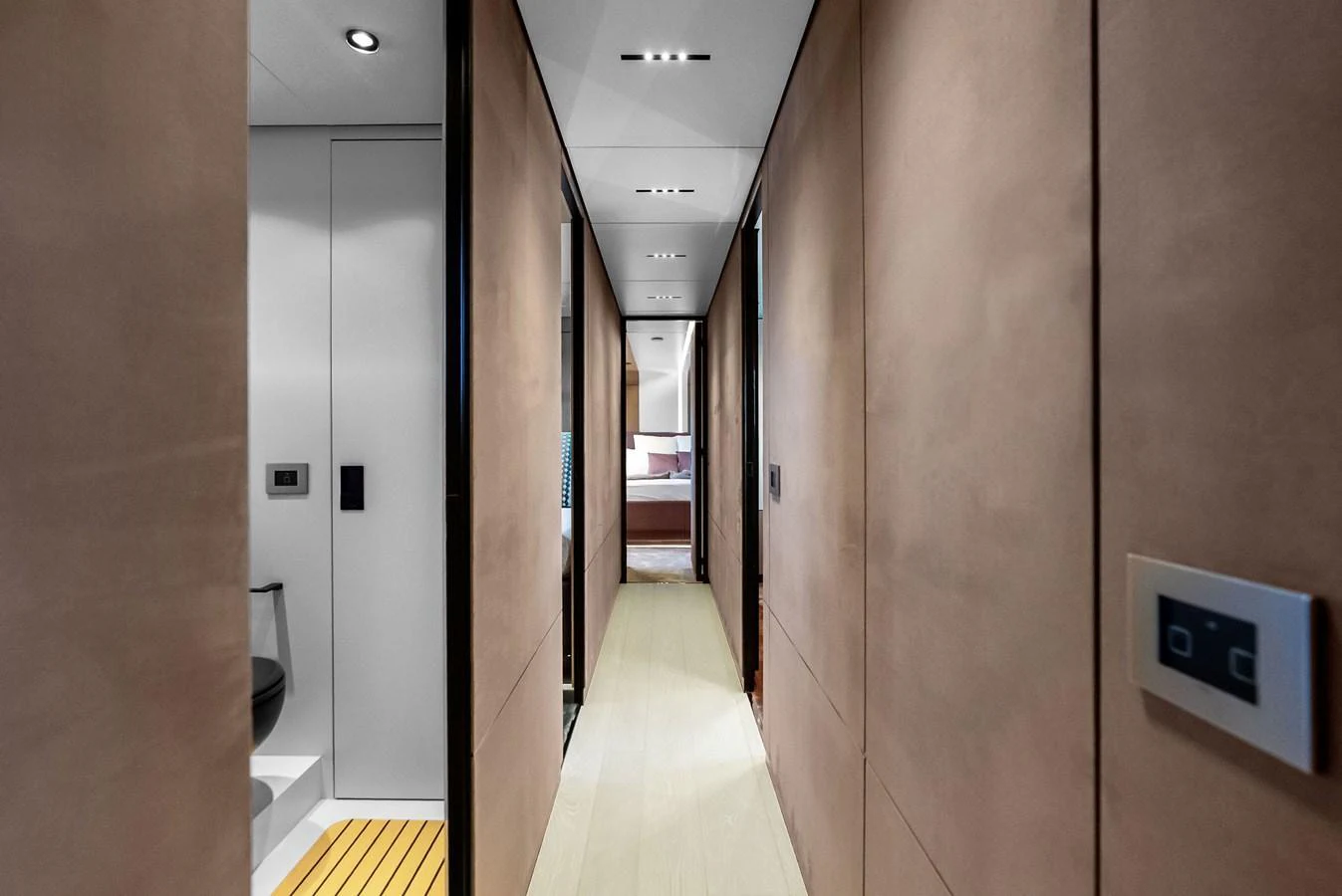 A sleek hallway with modern finishes leads to the yacht's living quarters. aboard ANOTHER WORLD Yacht for Sale