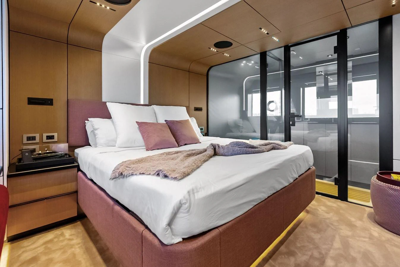 A luxurious stateroom featuring a plush bed and modern design elements. aboard ANOTHER WORLD Yacht for Sale