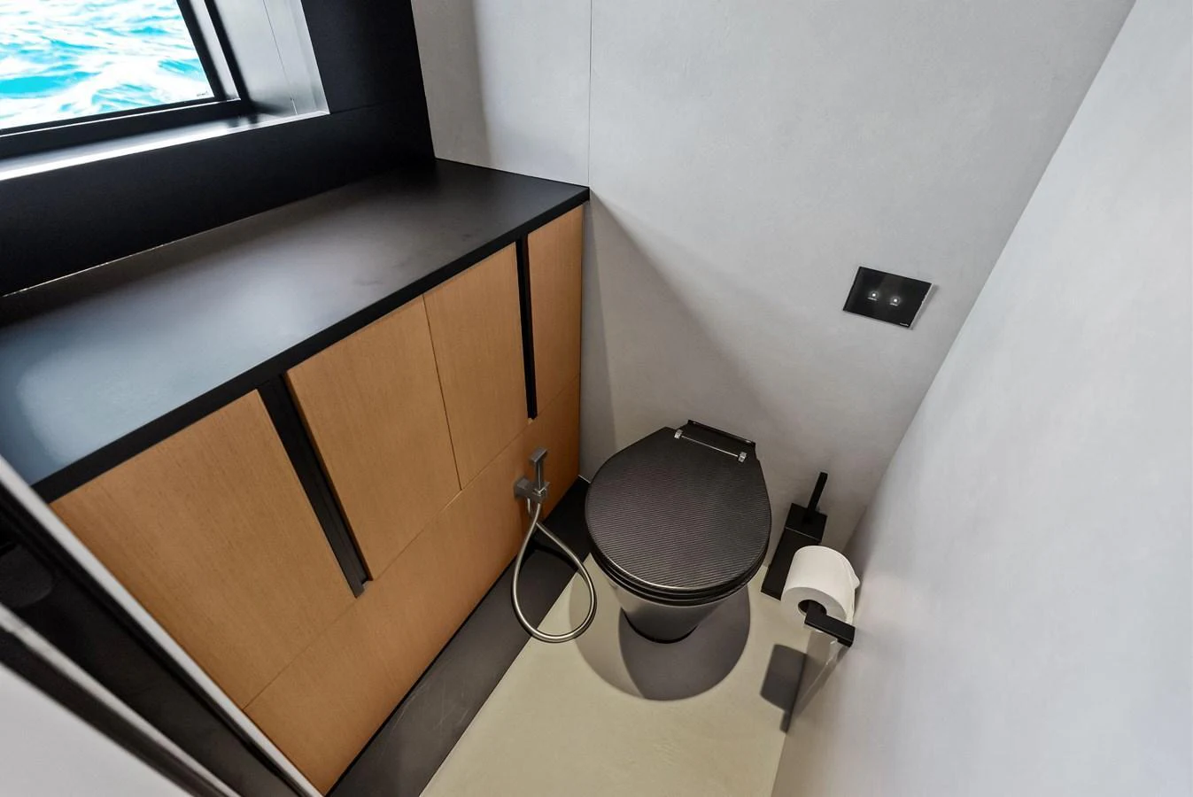 A modern yacht bathroom with sleek fixtures and a sea view. aboard ANOTHER WORLD Yacht for Sale