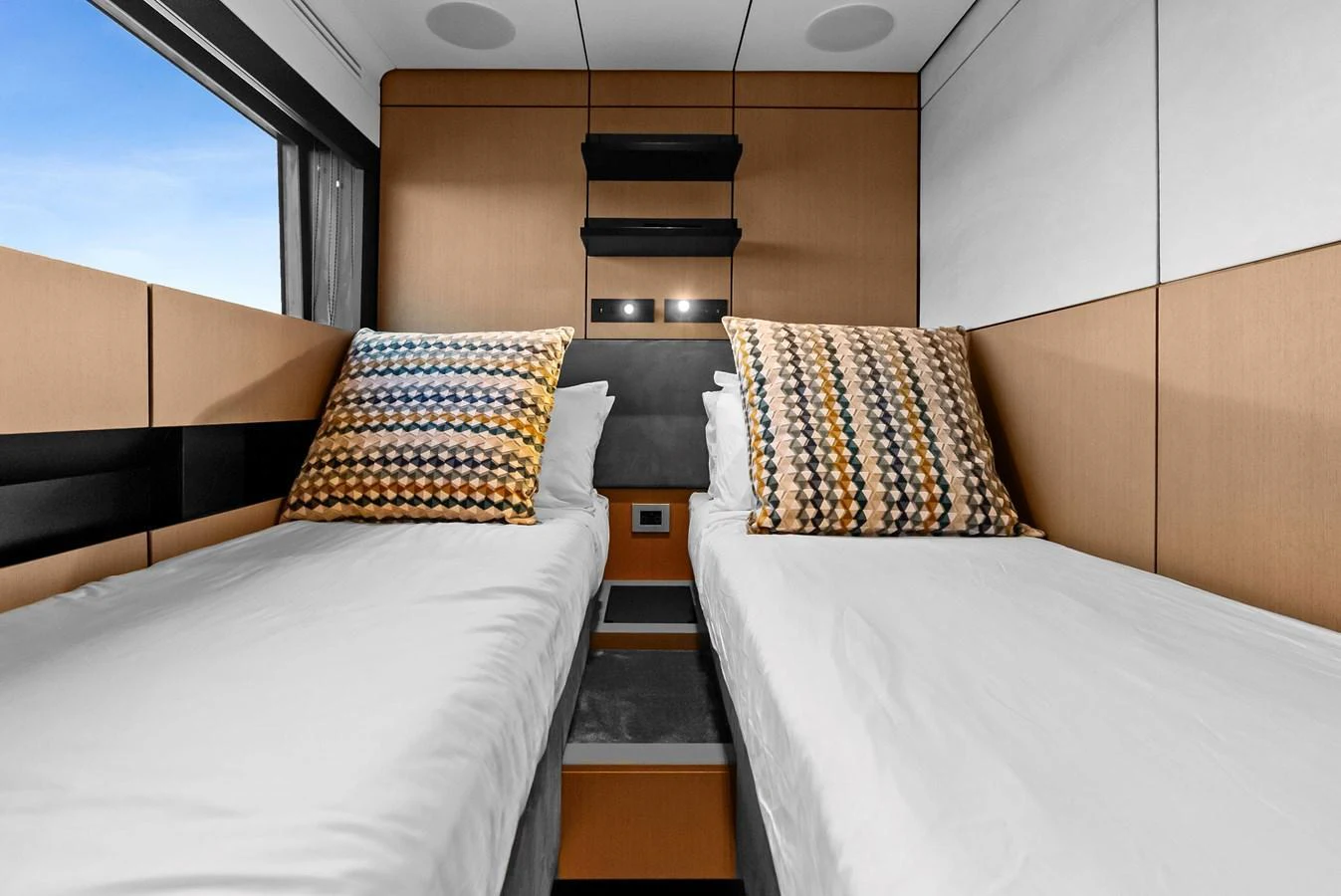 The twin stateroom offers a cozy and modern sleeping area with stylish decor. aboard ANOTHER WORLD Yacht for Sale