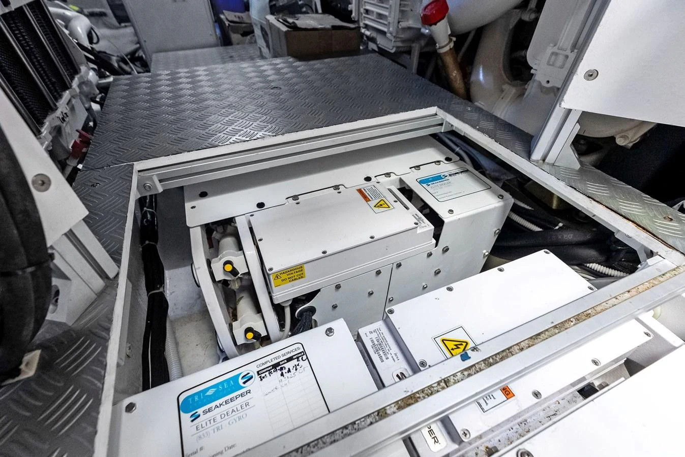 The image showcases the technical equipment and machinery within the yacht's engine room. aboard ANOTHER WORLD Yacht for Sale