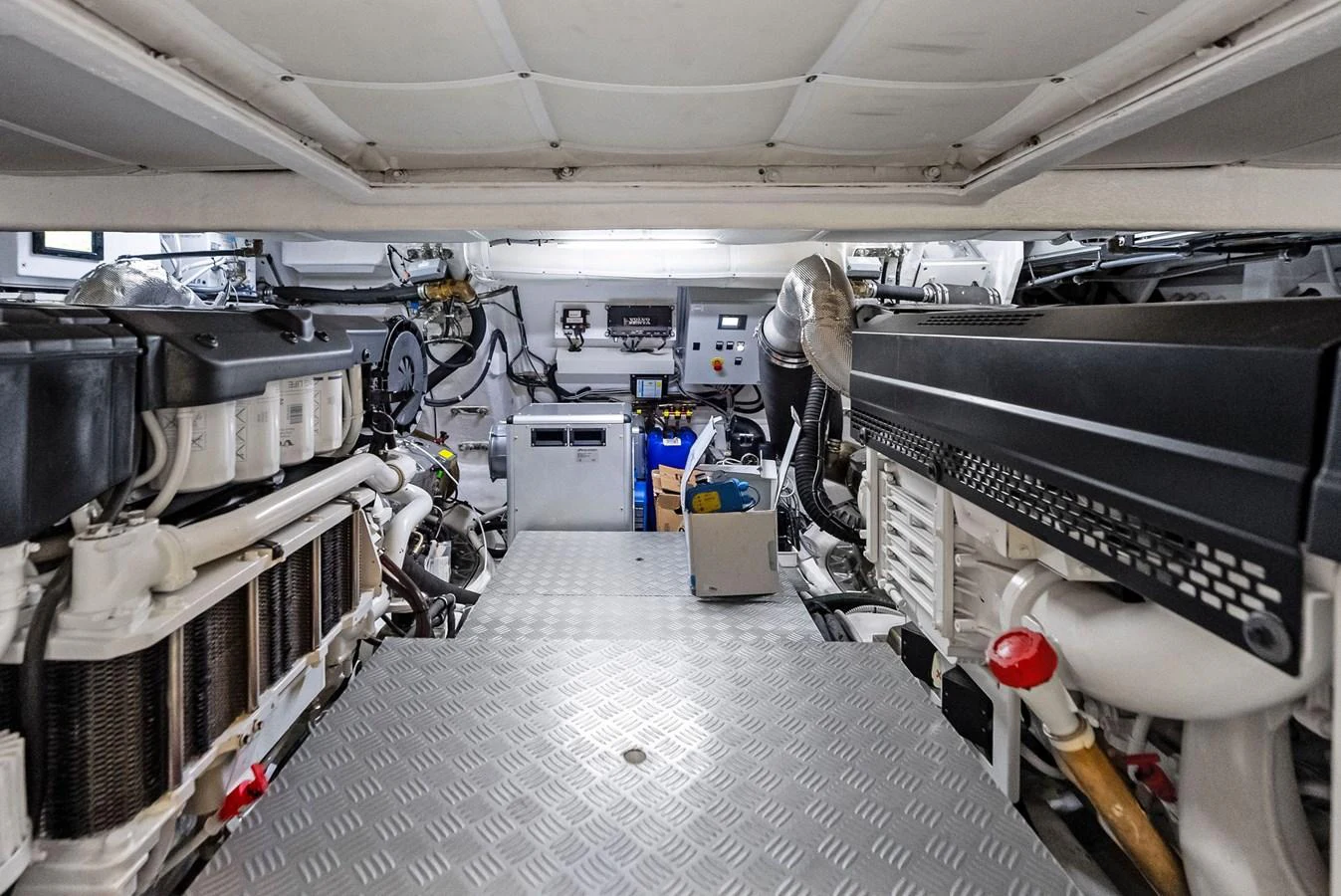 The image showcases the well-maintained engine room of the yacht, highlighting its mechanical components and systems. aboard ANOTHER WORLD Yacht for Sale