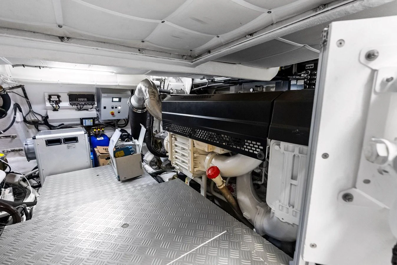 The image showcases the well-maintained engine room of the yacht, highlighting its mechanical components. aboard ANOTHER WORLD Yacht for Sale