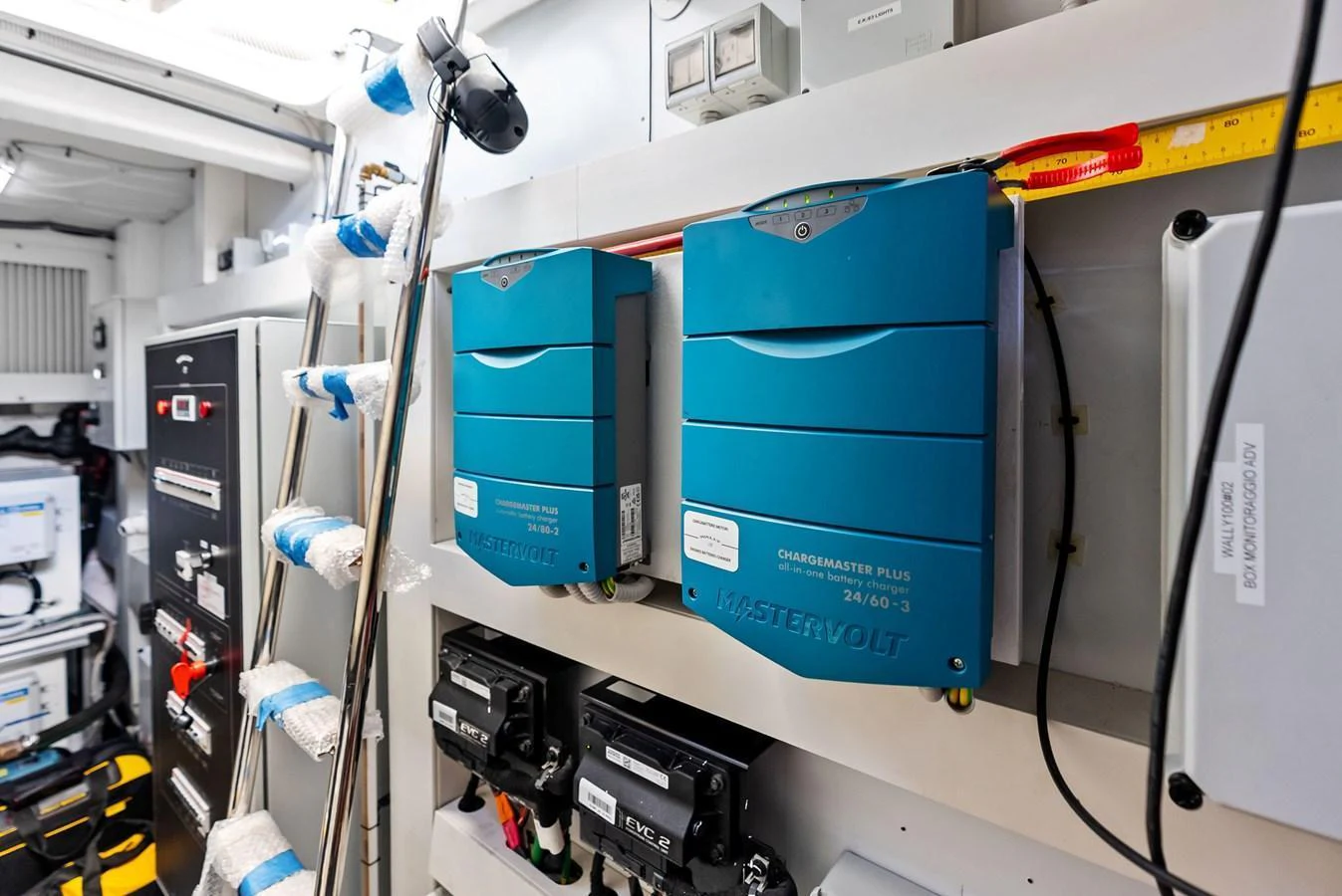 The image showcases the technical equipment and electrical systems within the yacht. aboard ANOTHER WORLD Yacht for Sale