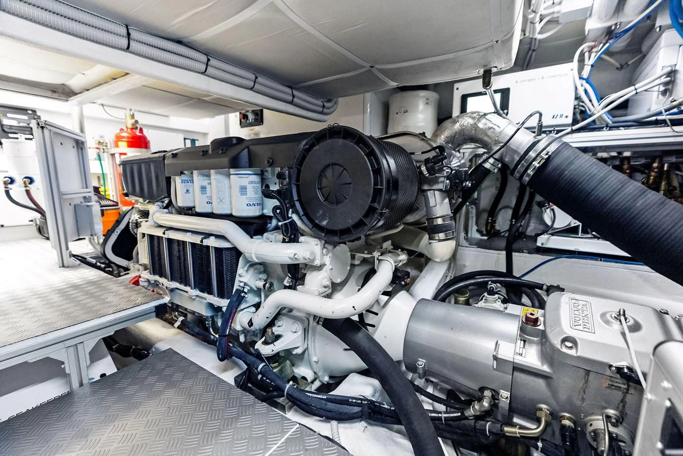 The image showcases the yacht's well-maintained engine room with visible machinery and components. aboard ANOTHER WORLD Yacht for Sale