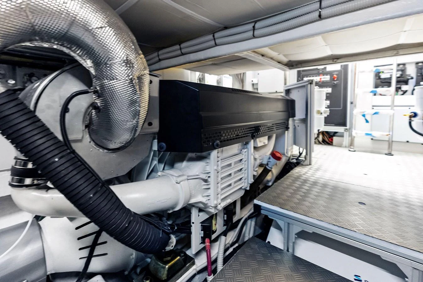 The image showcases the yacht's well-maintained engine room with advanced machinery and equipment. aboard ANOTHER WORLD Yacht for Sale