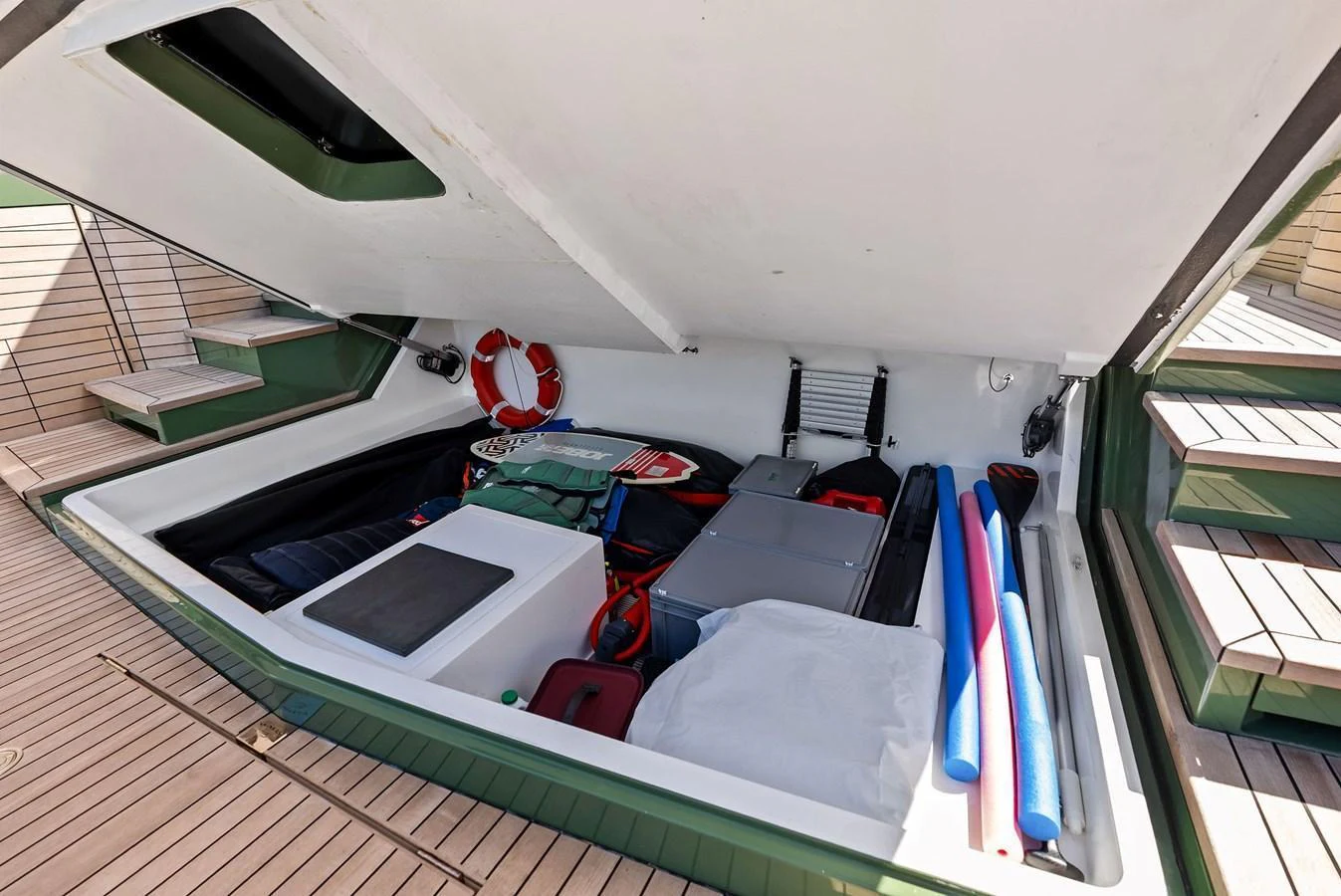 The yacht's storage compartment is well-organized with various equipment and accessories. aboard ANOTHER WORLD Yacht for Sale