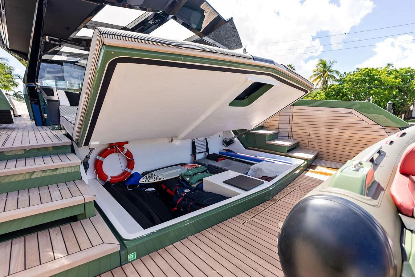 The image showcases a yacht's storage compartment with various equipment and a life ring. aboard ANOTHER WORLD Yacht for Sale