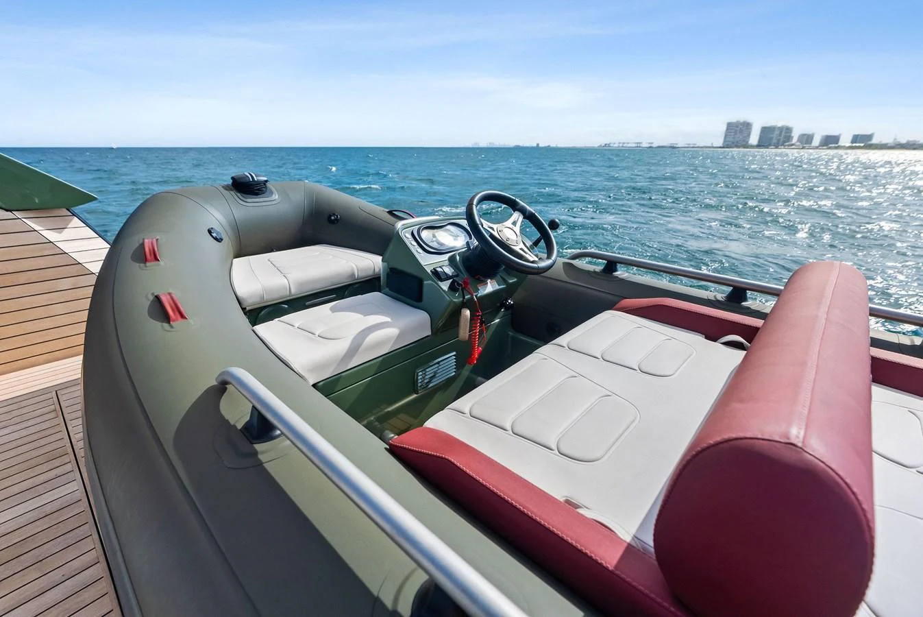 A sleek tender boat with comfortable seating and modern controls on the water. aboard ANOTHER WORLD Yacht for Sale