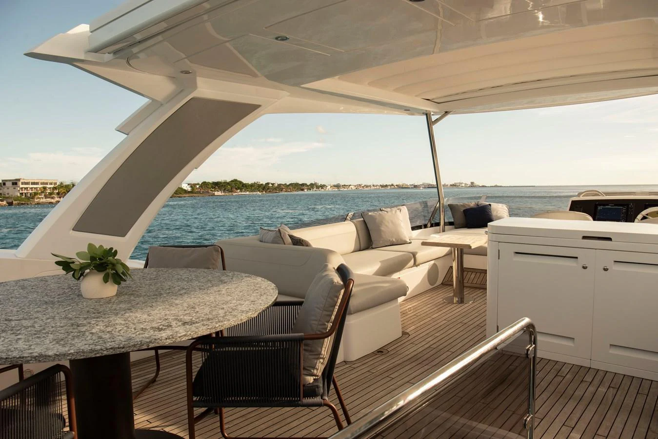 The aft deck offers a luxurious outdoor seating area with a stunning view of the water. aboard GAIA Yacht for Sale