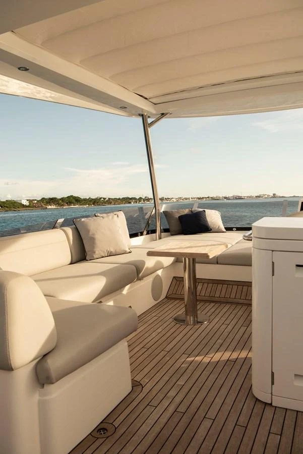 The aft deck offers a comfortable seating area with a scenic view of the water. aboard GAIA Yacht for Sale