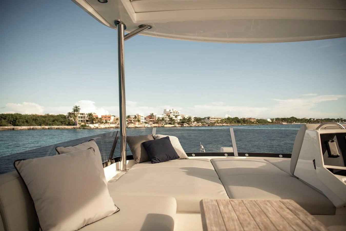 The sundeck offers a luxurious lounging area with plush seating and scenic views. aboard GAIA Yacht for Sale