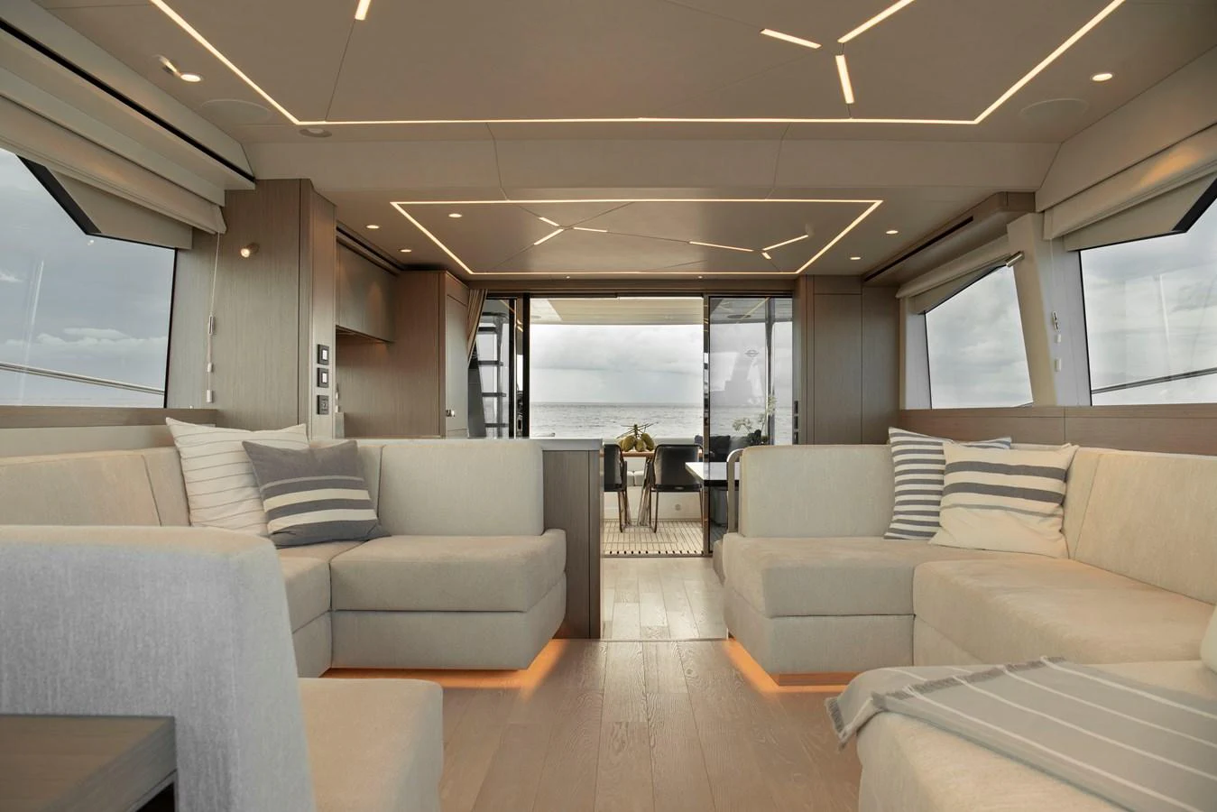 The yacht's salon features modern furnishings and ample seating with panoramic views. aboard GAIA Yacht for Sale