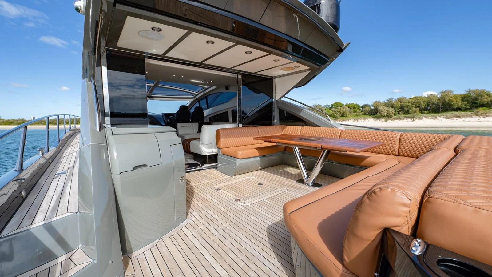 The aft deck features a spacious seating area with luxurious leather upholstery and a sleek, modern design. aboard ZAZA Yacht for Sale
