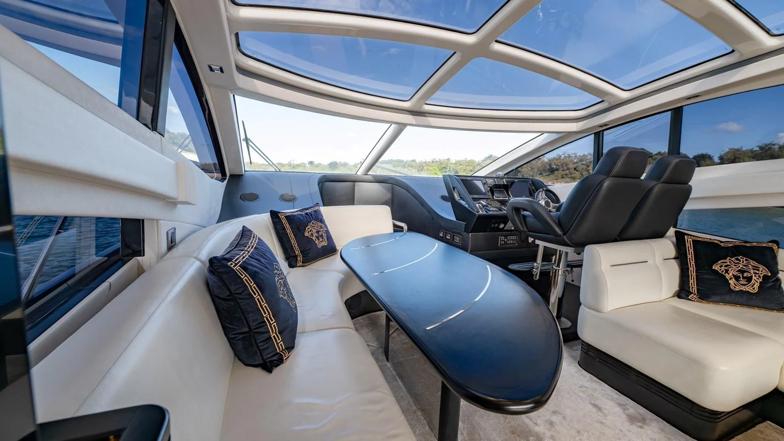 The helm area features luxurious seating and a sleek, modern design with panoramic windows. aboard ZAZA Yacht for Sale