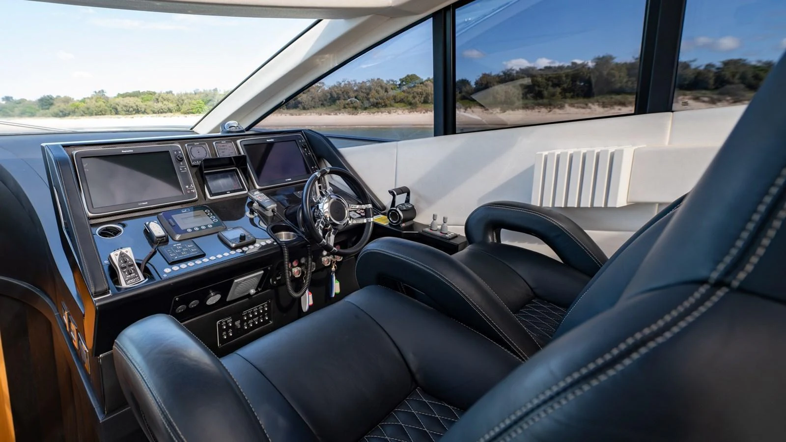 The helm station features state-of-the-art navigation equipment and luxurious seating. aboard ZAZA Yacht for Sale