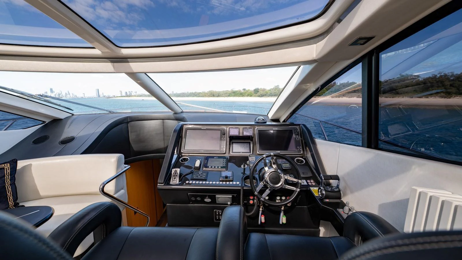 The helm station offers a panoramic view with state-of-the-art navigation equipment and luxurious seating. aboard ZAZA Yacht for Sale