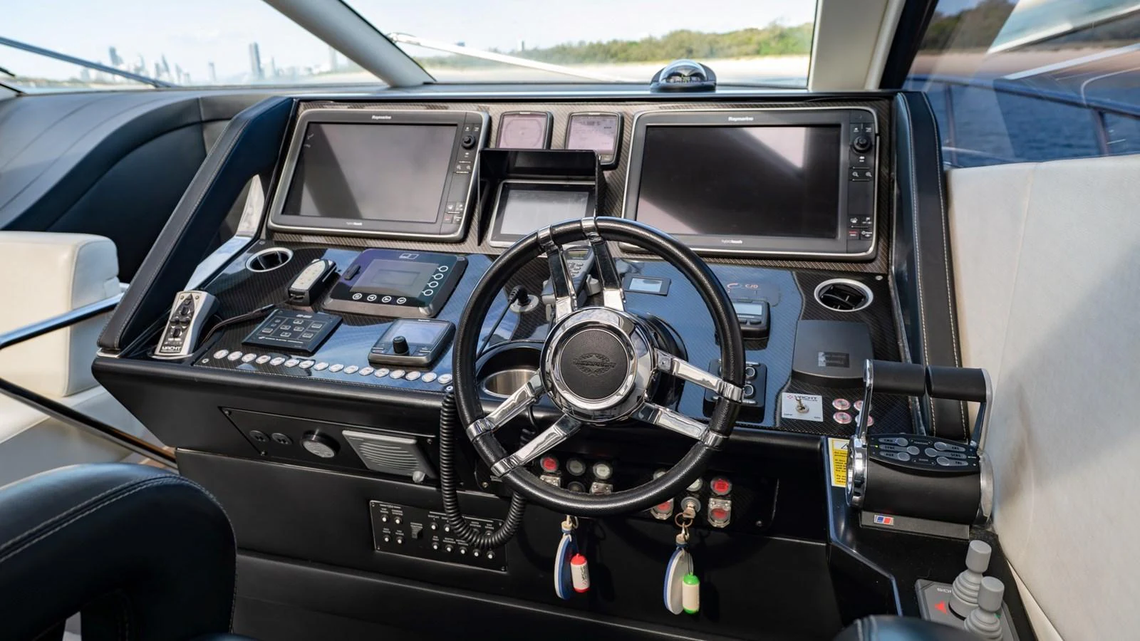 The helm station features advanced navigation equipment and a sleek steering wheel, offering a commanding view for the captain. aboard ZAZA Yacht for Sale