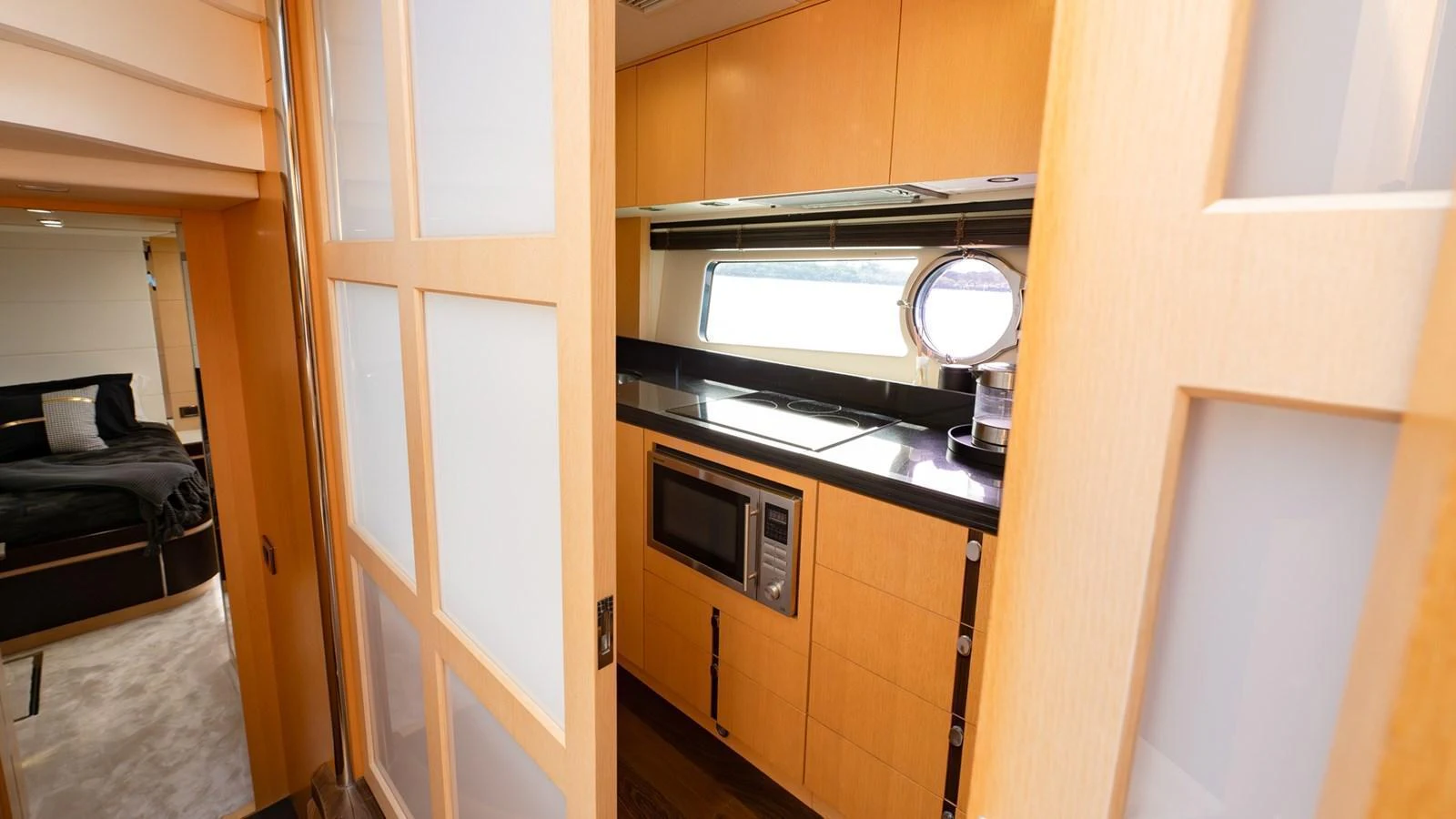 The yacht's galley features modern appliances and a sleek design, perfect for onboard culinary experiences. aboard ZAZA Yacht for Sale