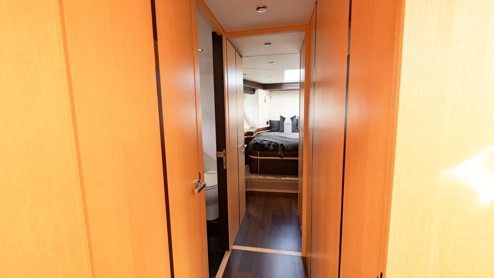 A cozy stateroom with wooden paneling and a comfortable bed. aboard ZAZA Yacht for Sale