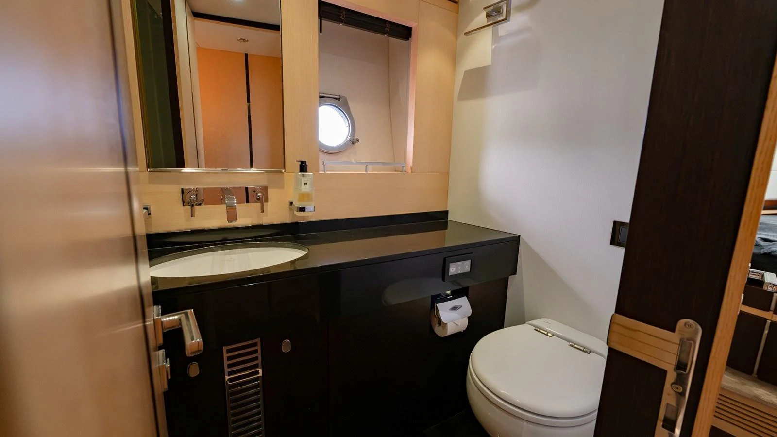 The yacht's head features modern fixtures and a sleek design. aboard ZAZA Yacht for Sale