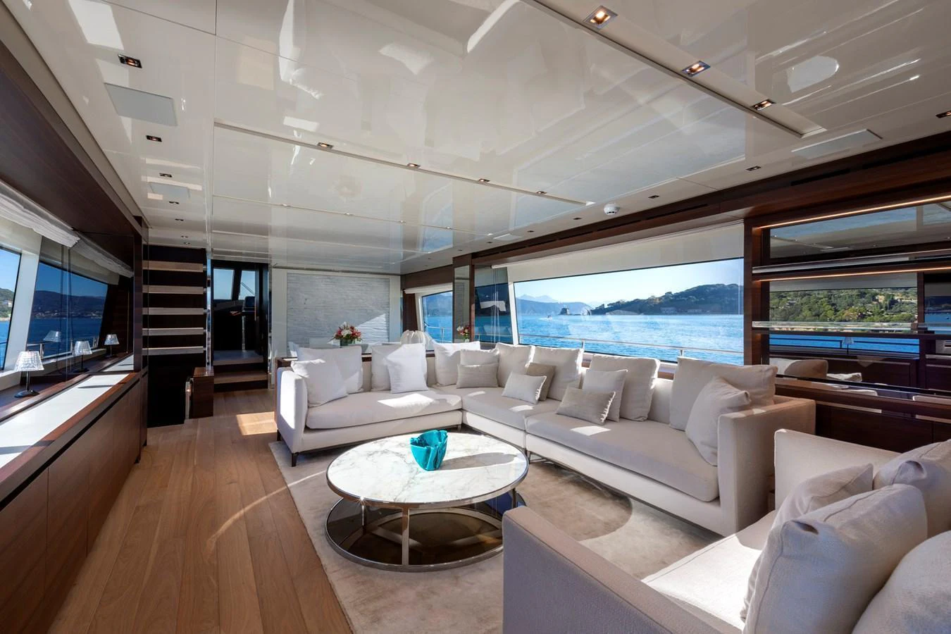 The spacious salon offers panoramic views and luxurious seating in a modern, elegant setting. aboard QUEEN MARTINA Yacht for Sale