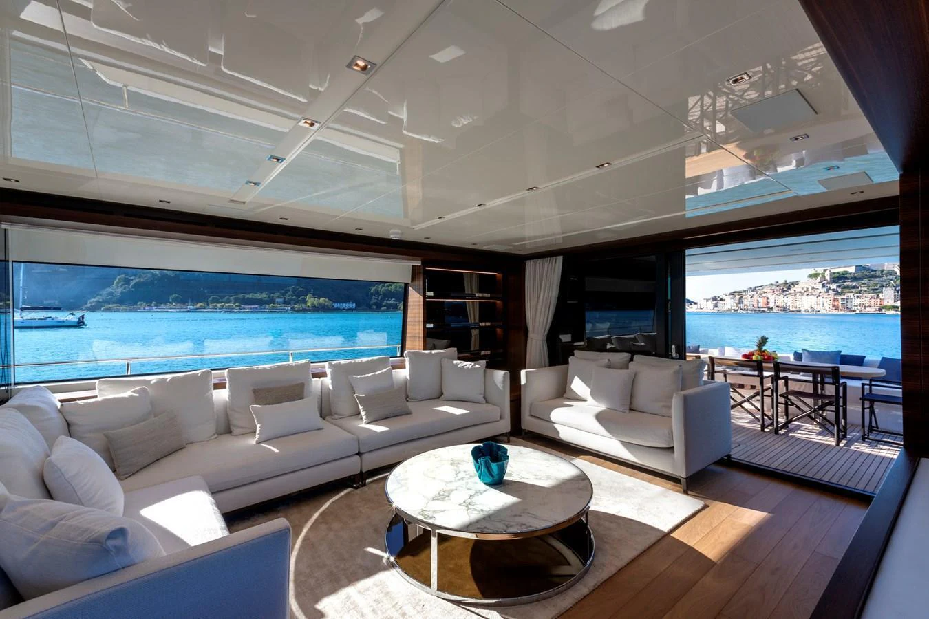 The spacious salon offers luxurious seating with panoramic views of the surrounding waters. aboard QUEEN MARTINA Yacht for Sale