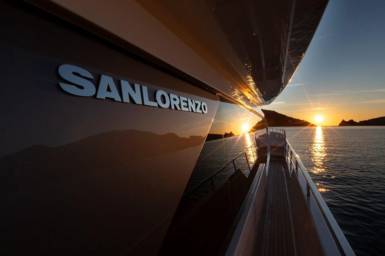 The yacht is shown at sunset with its sleek exterior reflecting the golden light. aboard QUEEN MARTINA Yacht for Sale
