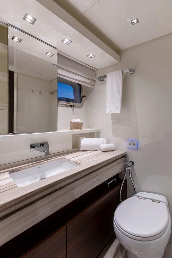 The yacht's bathroom features modern fixtures and a sleek design, offering a luxurious and comfortable space. aboard QUEEN MARTINA Yacht for Sale