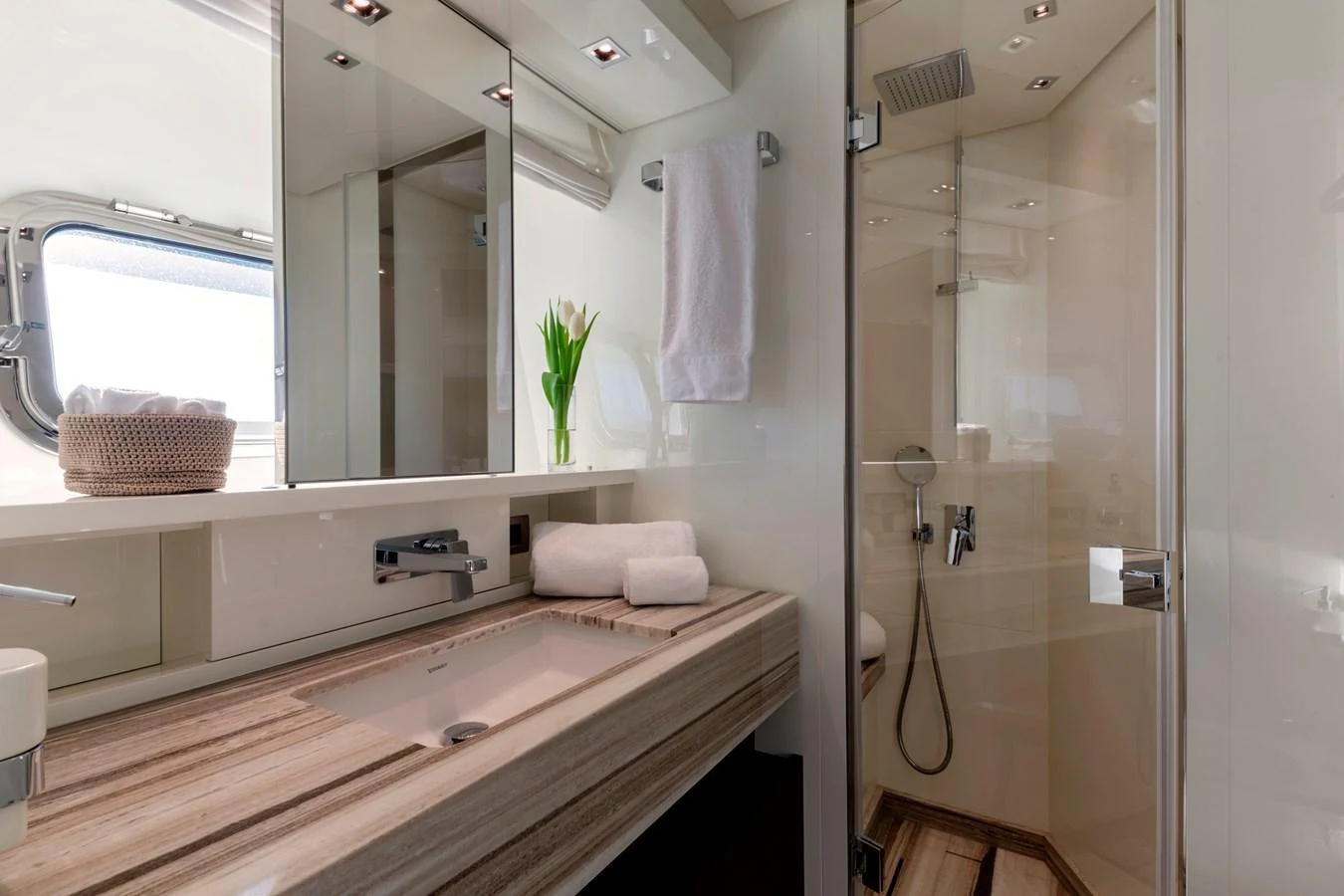 The yacht's bathroom features a sleek design with modern fixtures and ample natural light. aboard QUEEN MARTINA Yacht for Sale