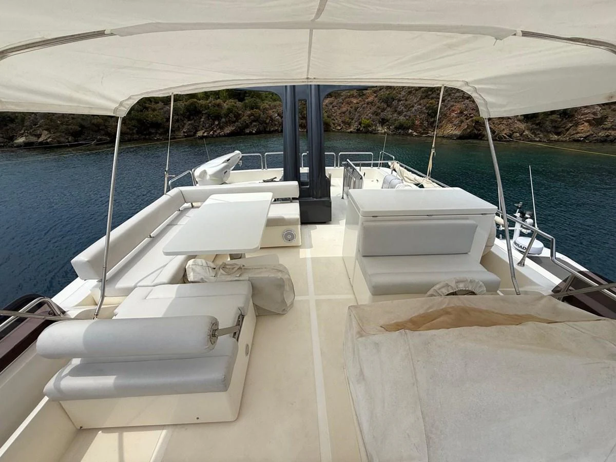 a boat on the water aboard NEVER TOO LATE Yacht for Sale